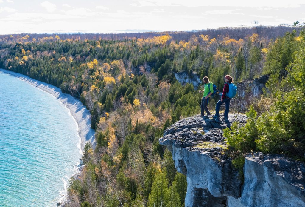 Couple on cliff hiking